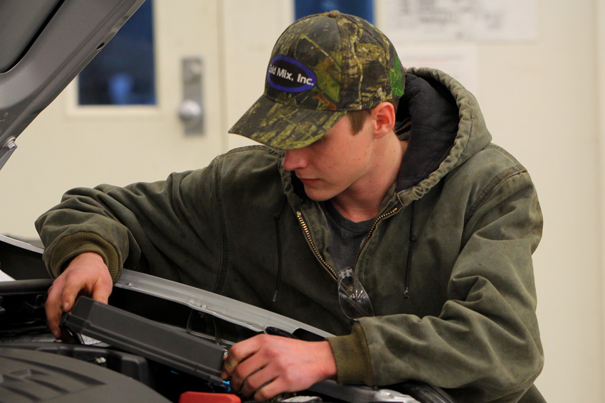 East Mississippi Community College student Cameron Bryce Hitt is one of five Automotive Technology students chosen to participate in a new pilot program that will allow students to earn certification through the University of Toyota. Here, Hitt inspects a 2015 Toyota Camry during a class exercise.