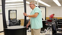 David Long sets up equipment for East Mississippi Community College’s new Barbering program. Long will oversee both the Cosmetology and Barbering programs at EMCC. Classes begin in August and a few spots in the Barbering program are still available.
