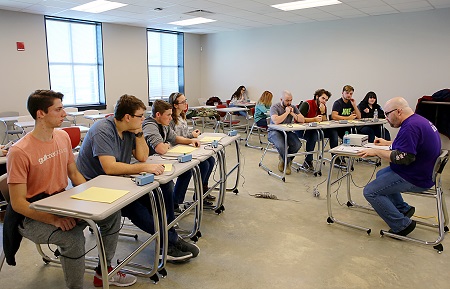 East Mississippi Community College’s quiz bowl team, seated at left, competes against Bevill State Community College’s team during the National Academic Quiz Tournaments’ Mississippi Community College Sectional.