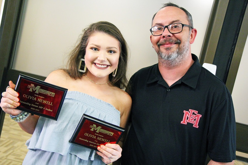 Olivia Newell, at left, was named the recipient of both the Outstanding Human Anatomy & Physiology II Student and the Outstanding American Literature Student during Awards Day on East Mississippi Community College’s Scooba campus. Newell is pictured here with humanities instructor Derrick Conner, who presented her with the American Literature award.