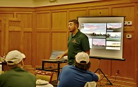 East Mississippi Community College Landscape Management Technology student John Ellis gives a presentation on his summer internship at a Florida golf course to his classmates, who all landed paid internships.