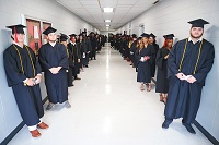 East Mississippi Community College graduates line up prior to a Dec. 13 commencement ceremony that took place on the college’s Scooba campus. Graduates from all EMCC campuses took part in the graduation ceremony. 