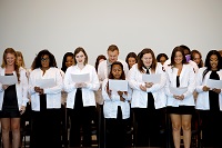 Students enrolled in the Associate Degree Nursing program on East Mississippi Community College’s Golden Triangle campus recite the Nursing Oath during a White Coat Ceremony that took place Sept. 23 at The Communiversity.