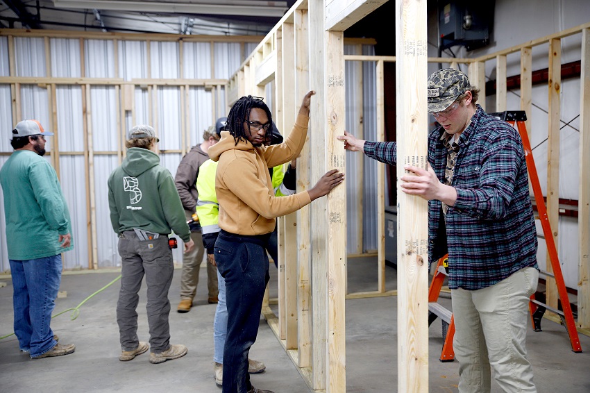 Students in East Mississippi Community College’s Construction Engineering Technology class frame walls for a free Commercial/Residential Electrical training program the college will offer to men in a residential treatment facility in West Point. 